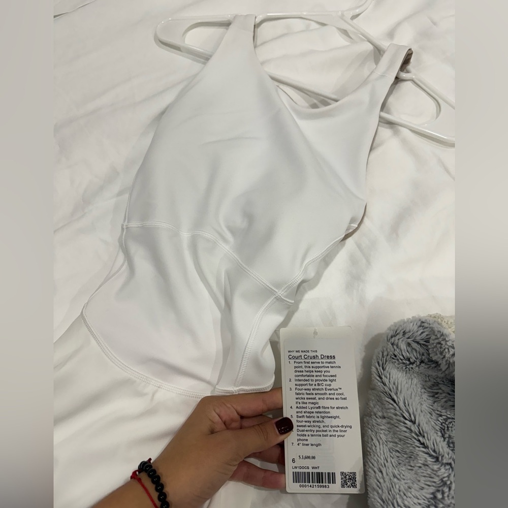 White sporty dressed bought in lululemon never used. New with tags.